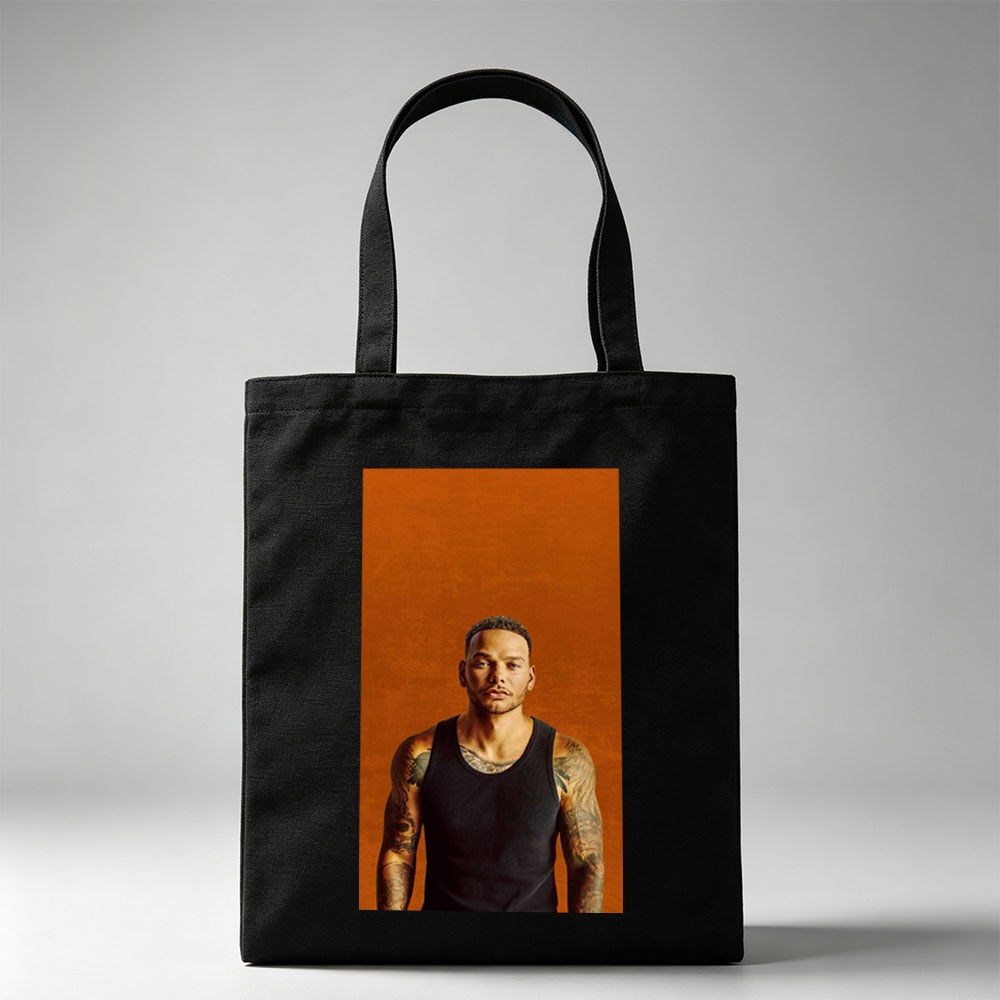 Liam Payne Standing in Black Tank Top with Visible Tattoos Against Orange Background - Canvas tote bags