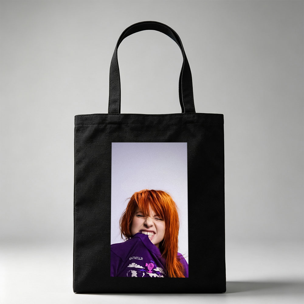 Hayley Williams from Paramore in a Playful Pose Wearing a Purple Nashville Shirt with a Vibrant Design - Canvas tote bags