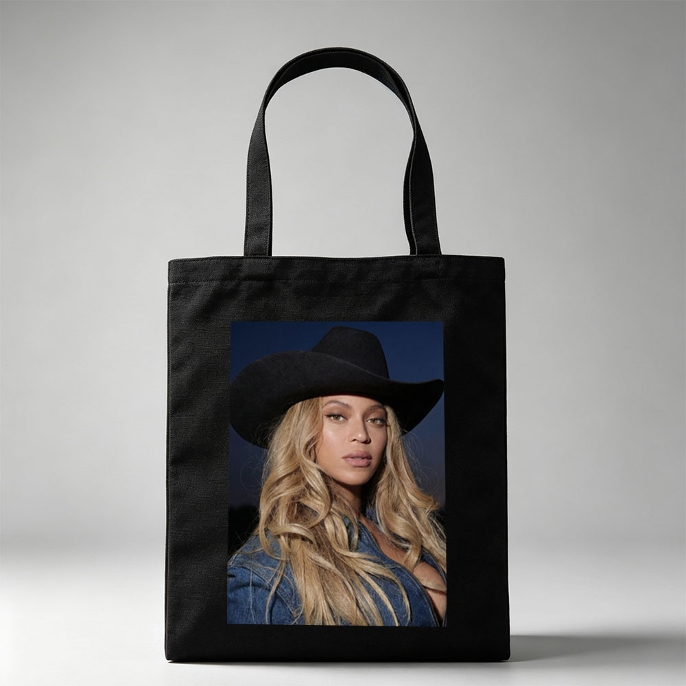 Beyonce in Cowboy Hat and Denim Jacket Against Dark Sky Background - Canvas tote bags