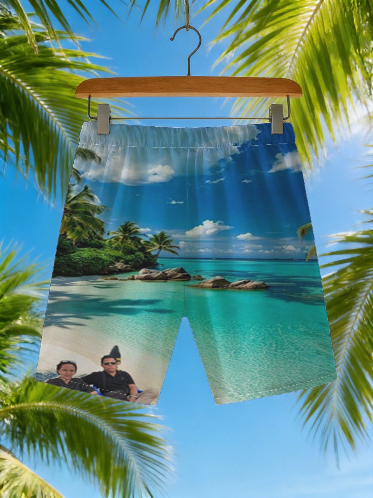 Couple relaxing on a tropical beach with turquoise waters and palm trees -  Beach shorts