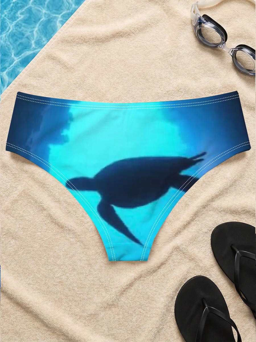 Sea turtle glides through a sunlit underwater cave. -  Men's swim trunks
