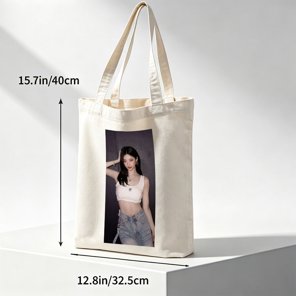 Korean Celebrity in Casual Outfit Wearing White Adidas Crop Top and High-Waisted Jeans Against Dark Background - Canvas tote bags