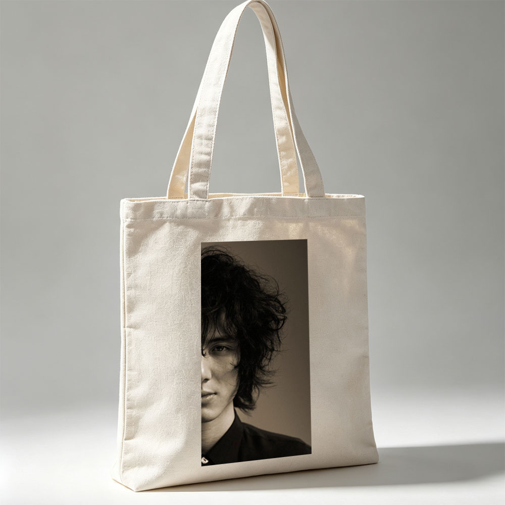 Evan Peters in a Dramatic Portrait with Messy Hair and Intense Gaze - Canvas tote bags