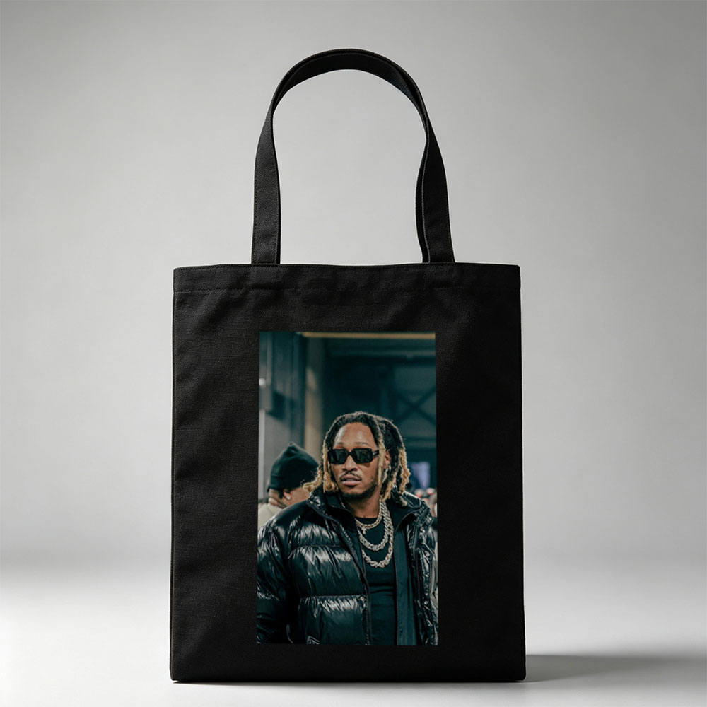 Tory Lanez at a Music Event Wearing a Black Puffer Jacket and Sunglasses - Canvas tote bags