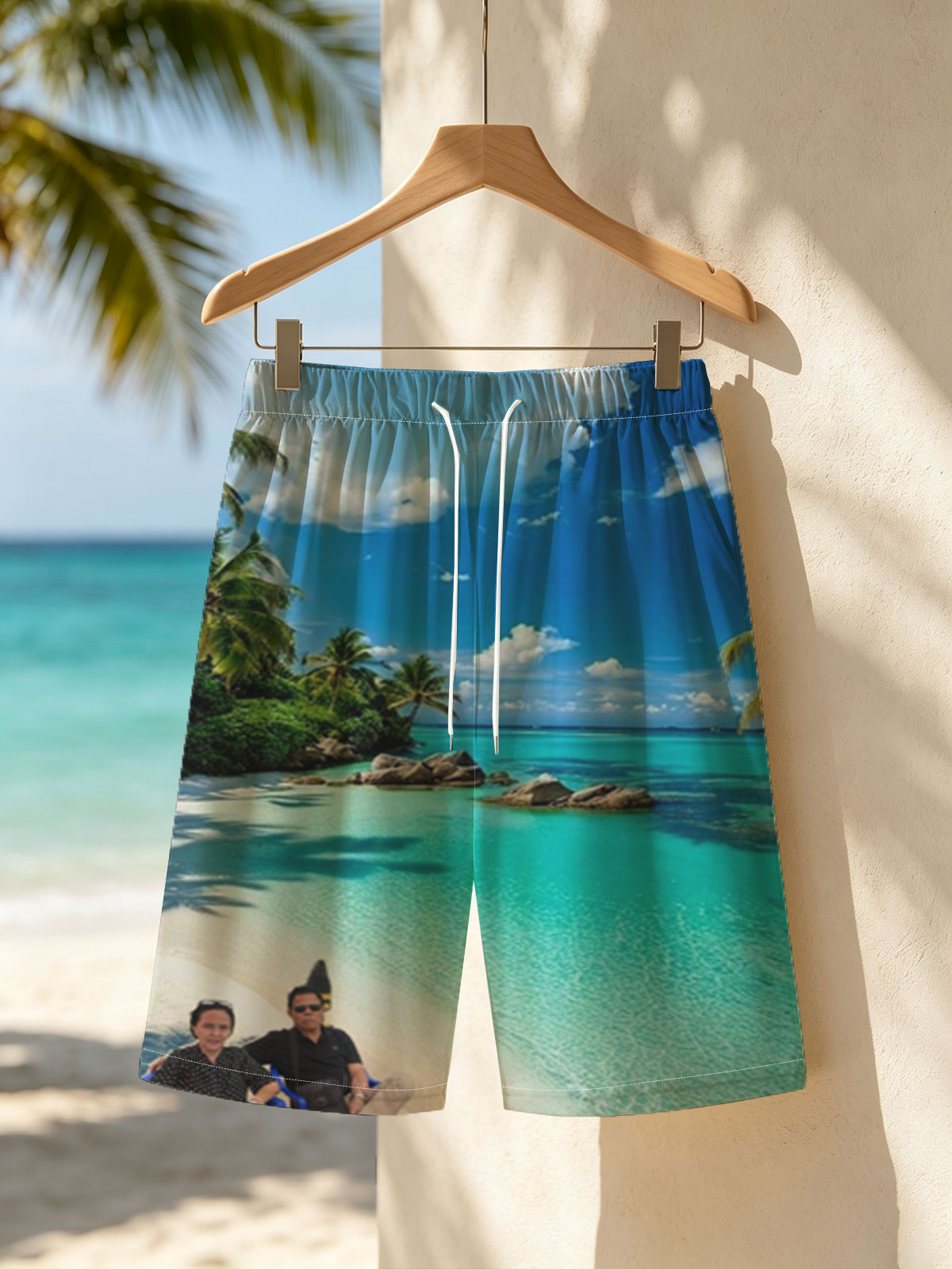 Couple relaxing on a tropical beach with turquoise waters and palm trees -  Beach shorts