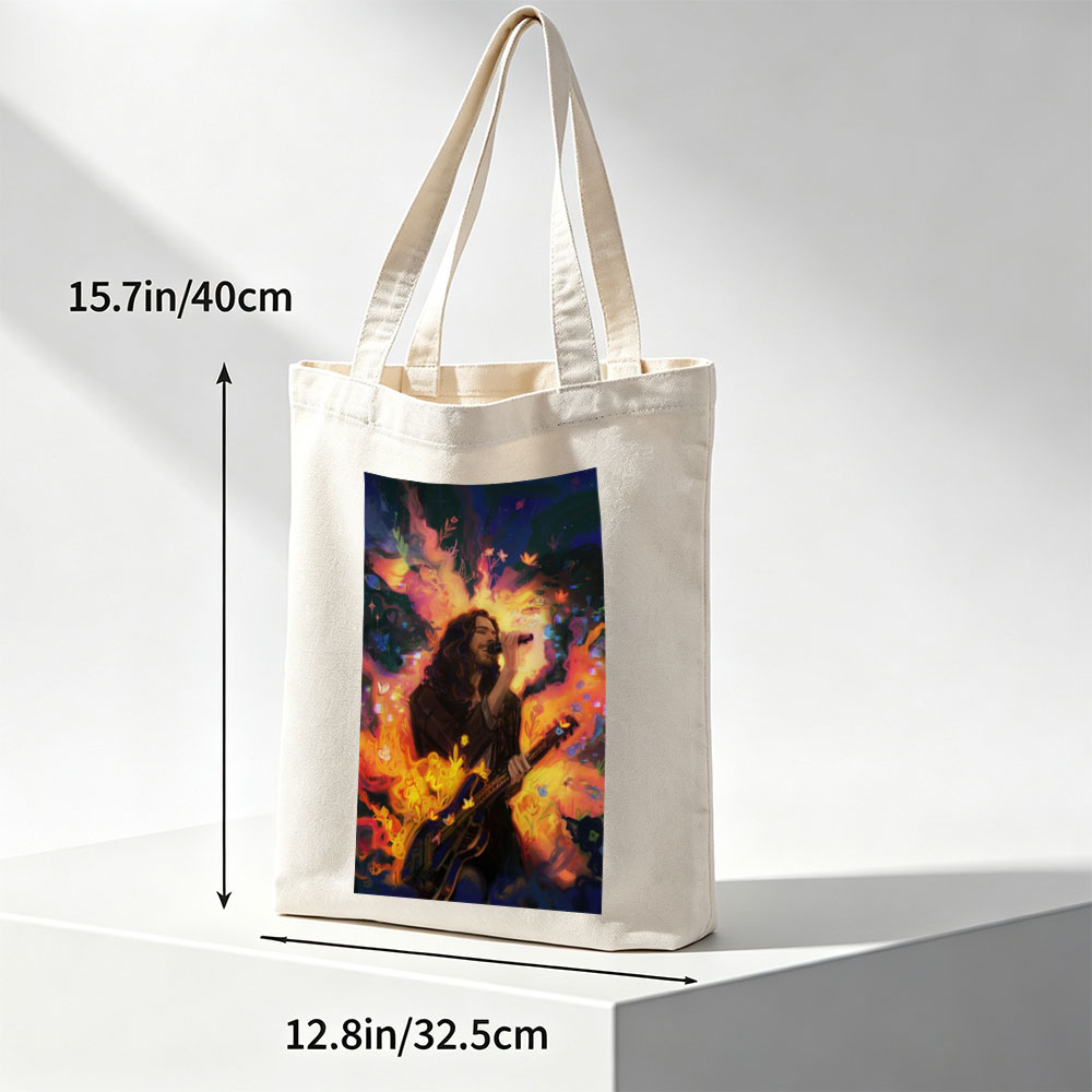 Hozier Performing with Guitar Amidst Vibrant Flames and Flowers Artwork - Canvas tote bags