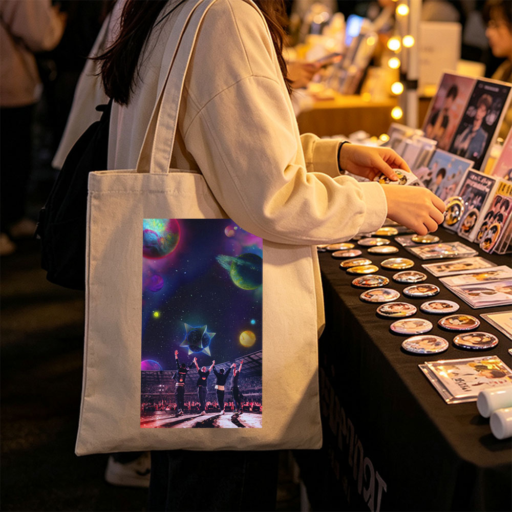 Coldplay Live Performance in a Cosmic Stadium with Vibrant Planets and Starry Sky Background - Canvas tote bags
