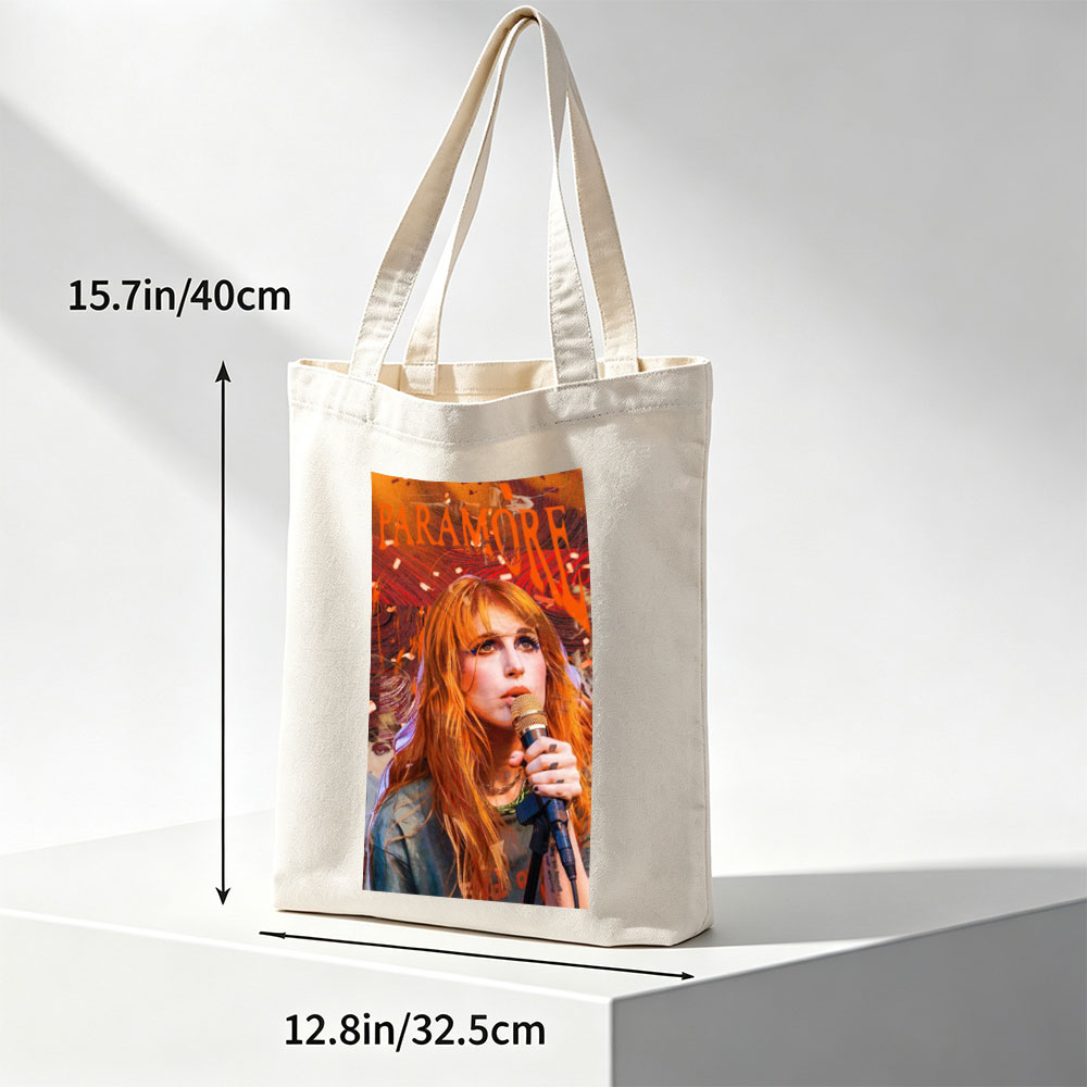Paramore Live Performance - Hayley Williams Singing into Microphone with Vibrant Stage Background - Canvas tote bags