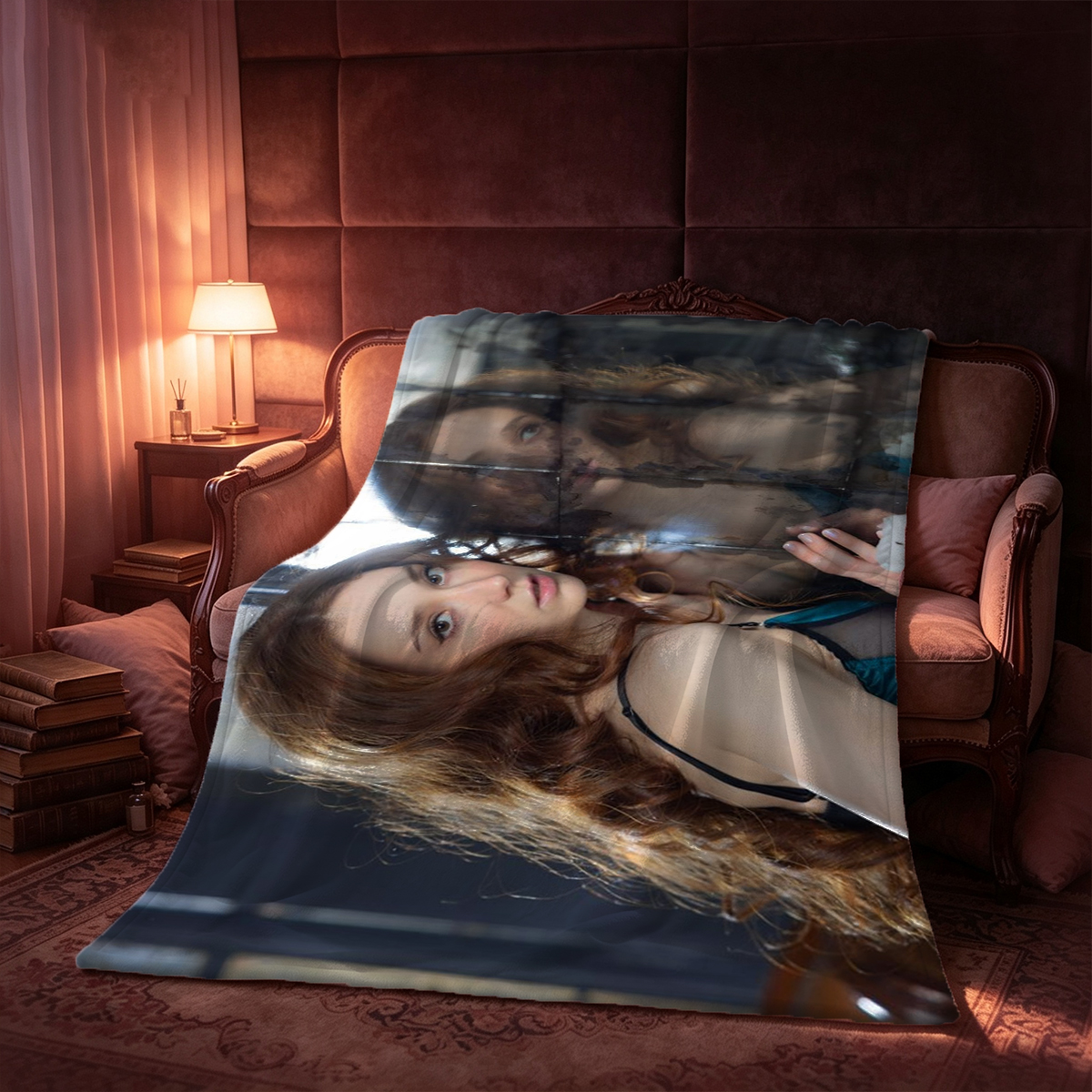 Two beautiful women in sheer lingerie, one standing and fondling her breasts while the other sits on a wooden chair kissing her body in a flower-filled romantic studio. - Blanket