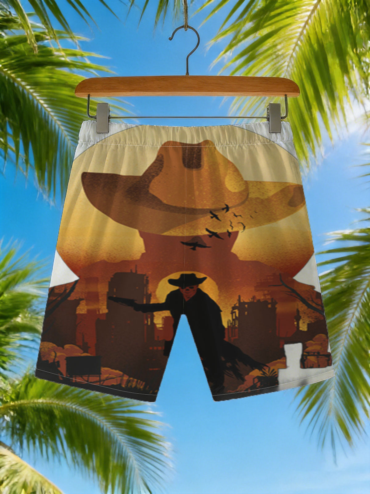 Cowboy Silhouette Against Sunset with Giant Hat and Birds in Sky -  Beach shorts