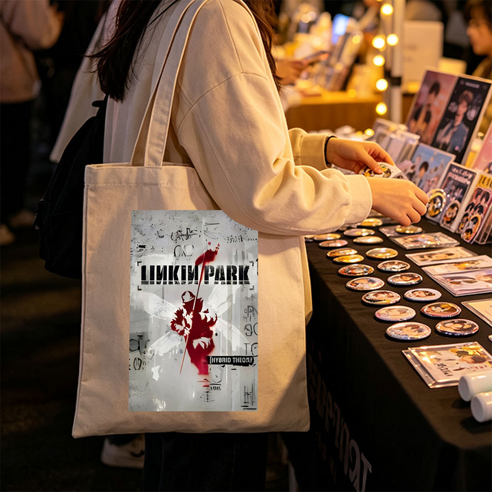 Linkin Park Album Cover Featuring a Red Silhouette of an Angel with Wings and a Spear Against a Graffiti-Style Background - Canvas tote bags