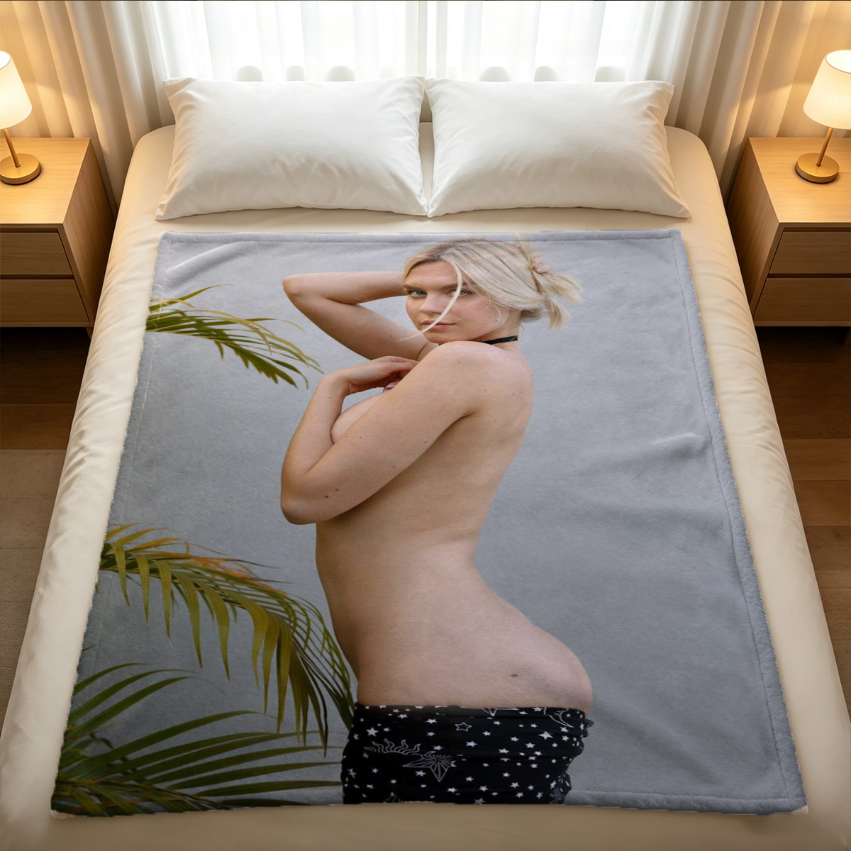 Nude woman lying on couch with legs raised, looking at camera. - Blanket