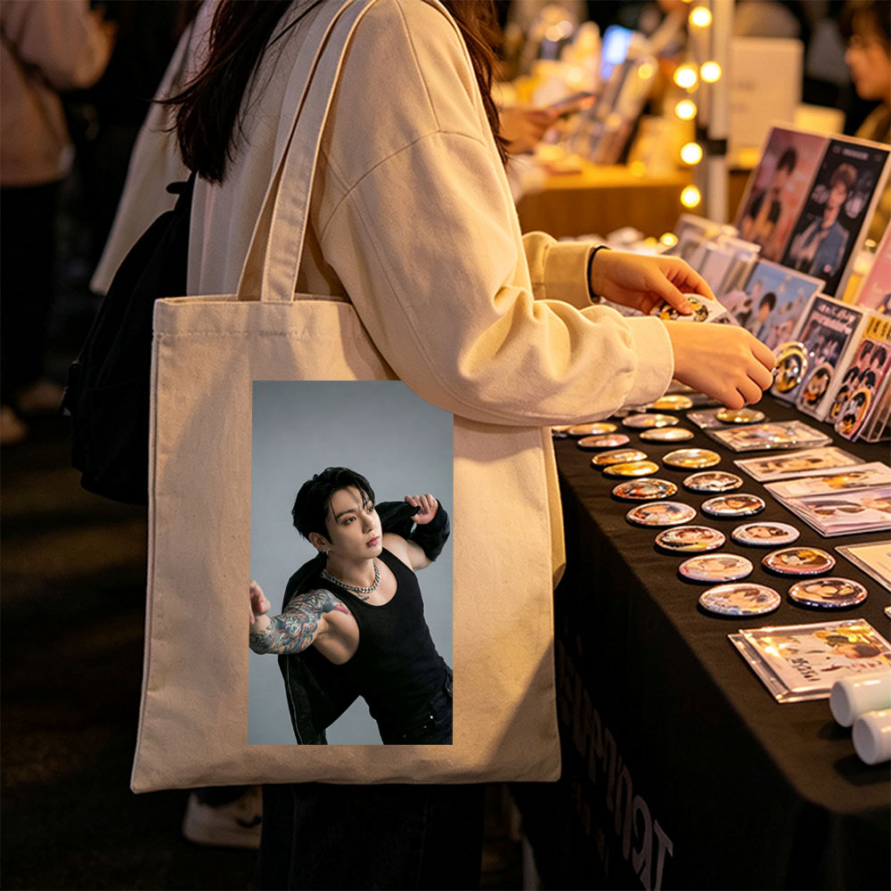 BTS Jungkook in a Powerful Pose with Tattooed Arm and Black Tank Top - Canvas tote bags