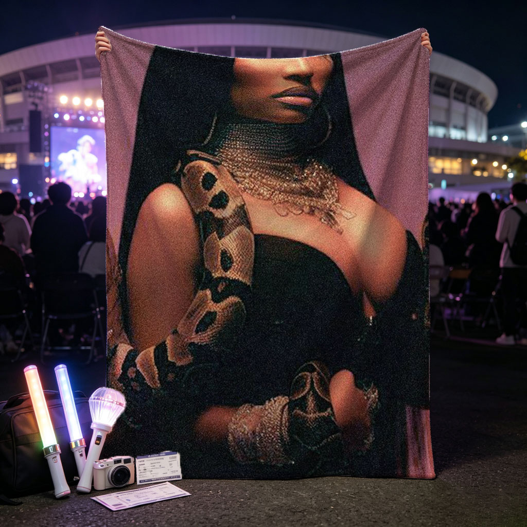 Nicki Minaj in a Dramatic Pose with a Snake Wrapped Around Her Arm and Neck, Wearing a Black Outfit and Heavy Jewelry - Blankets