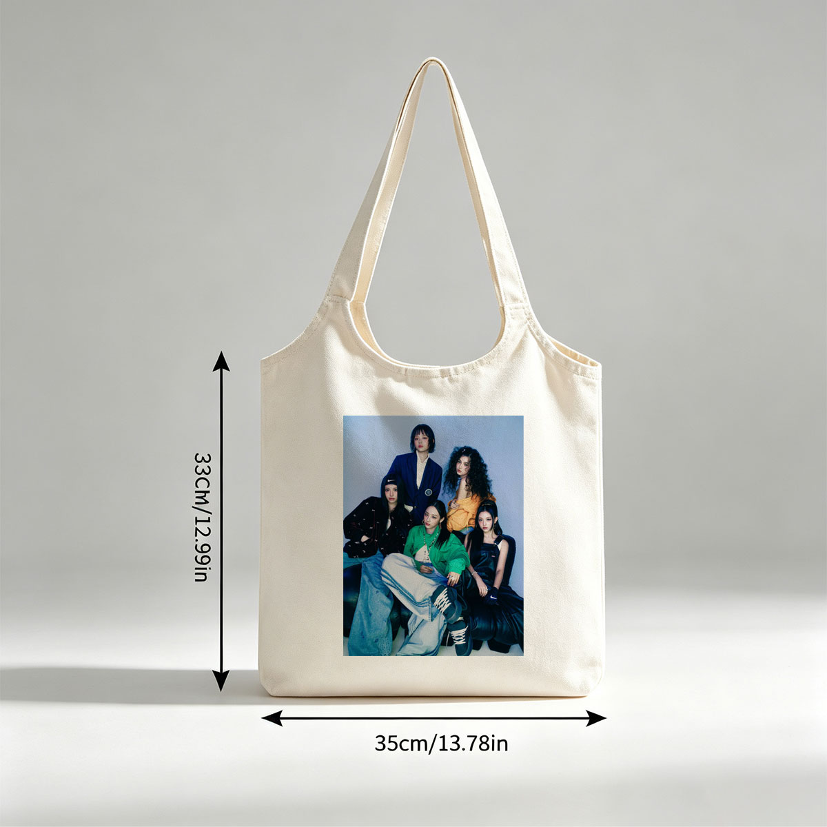 NewJeans Group Photo - Five Members in Stylish Outfits Posed Against a Blue Background - Canvas shoulder bags/
