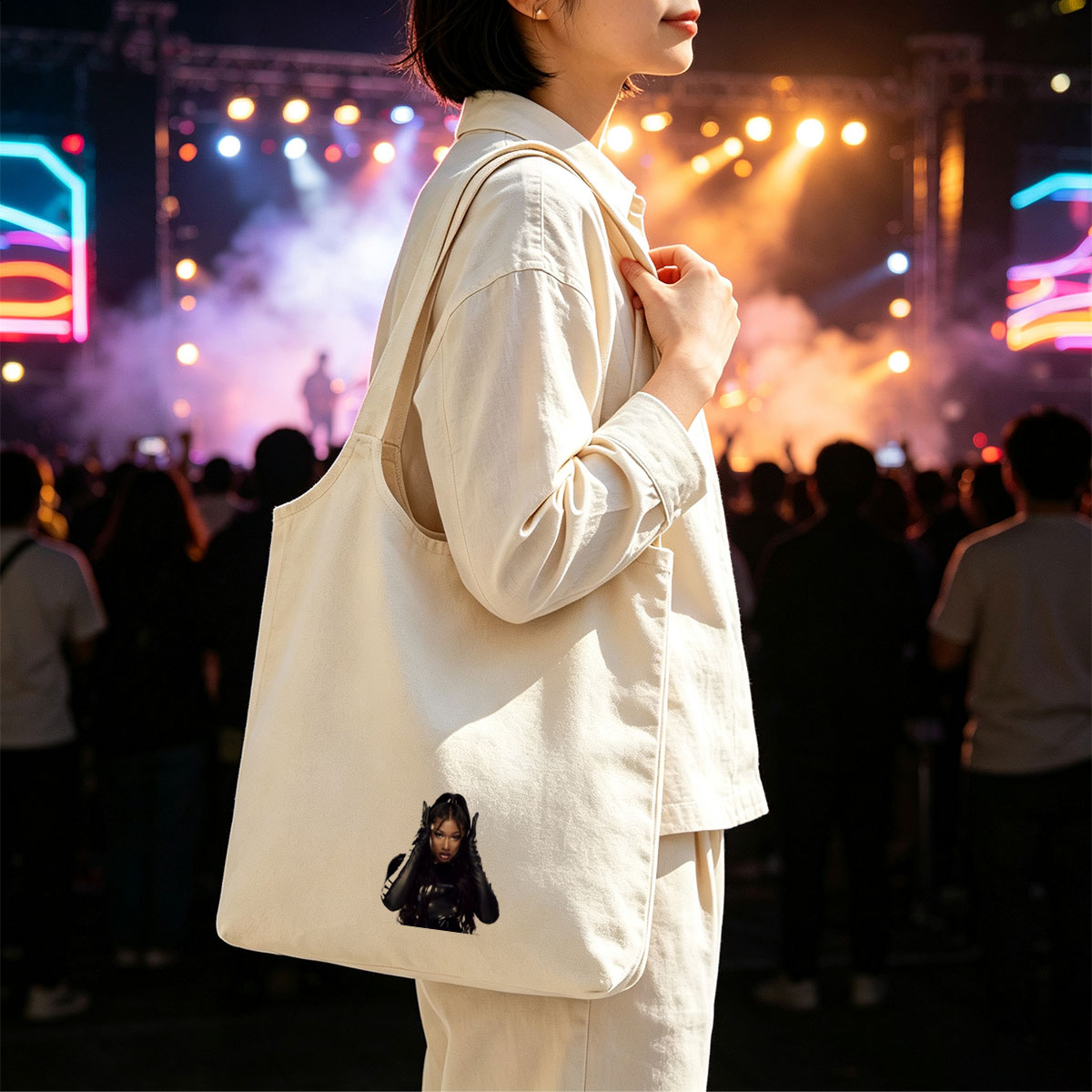 Megan Thee Stallion in a Bold Black Outfit with Hands on Head Against White Background - Canvas shoulder bags/