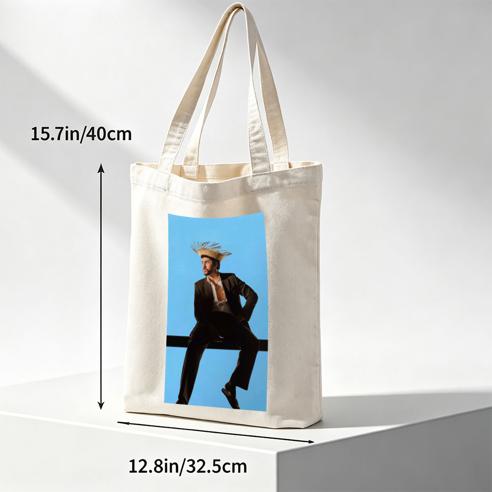 Bad Bunny in a Bold Fashion Statement Wearing a Straw Hat and Suit Against a Blue Background - Canvas tote bags