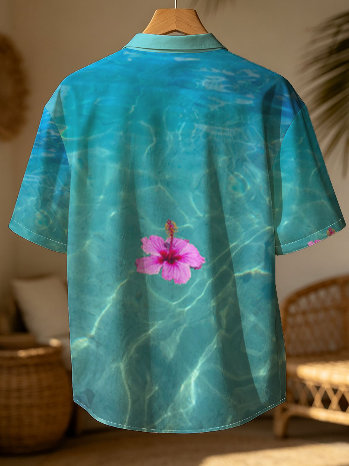 Pink hibiscus floating on crystal clear turquoise water -  Shirt