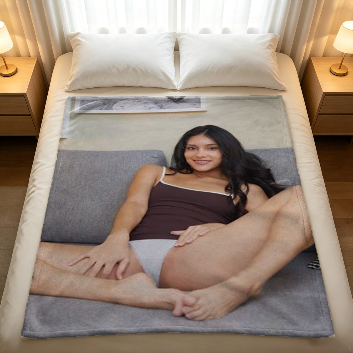 A woman in an unbuttoned white shirt posing on a bed. - Blanket