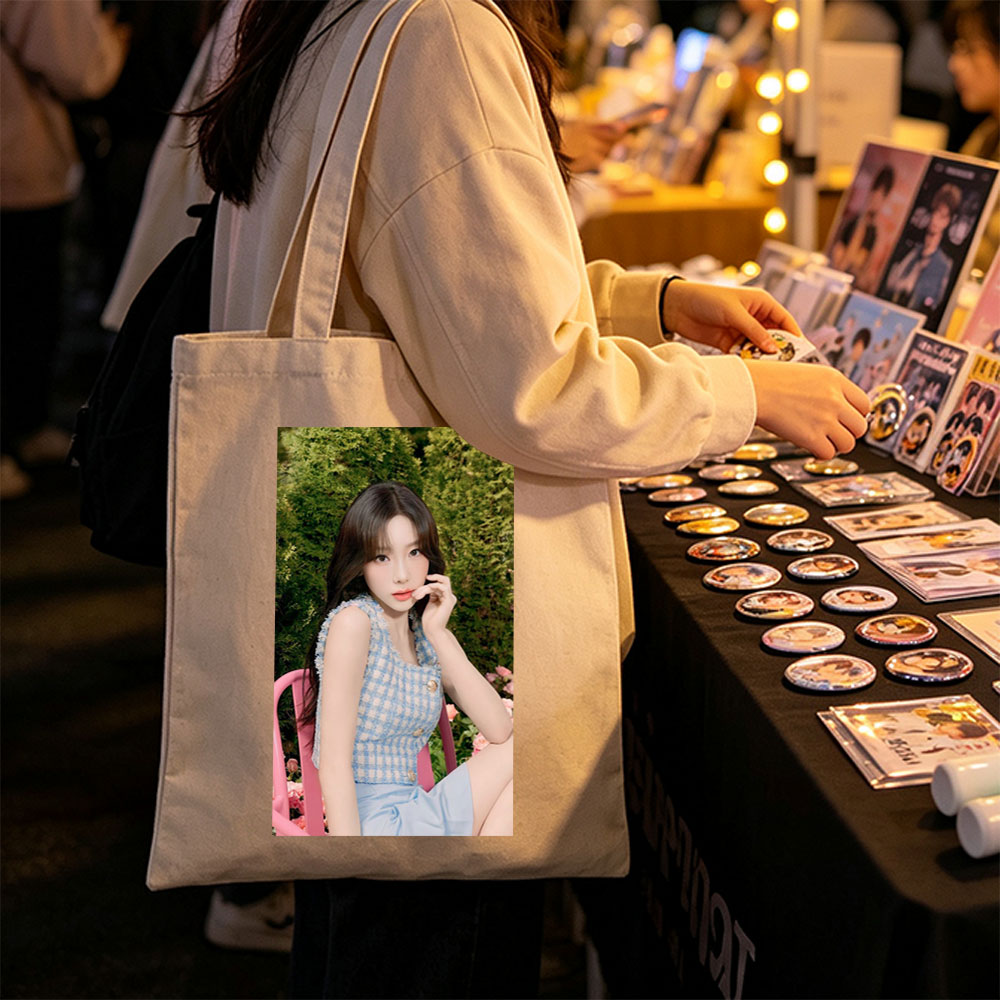 Tzuyu in a Garden Scene Wearing a Blue Checkered Top and Light Blue Skirt, Sitting on a Pink Chair Amidst Greenery and Flowers - Canvas tote bags
