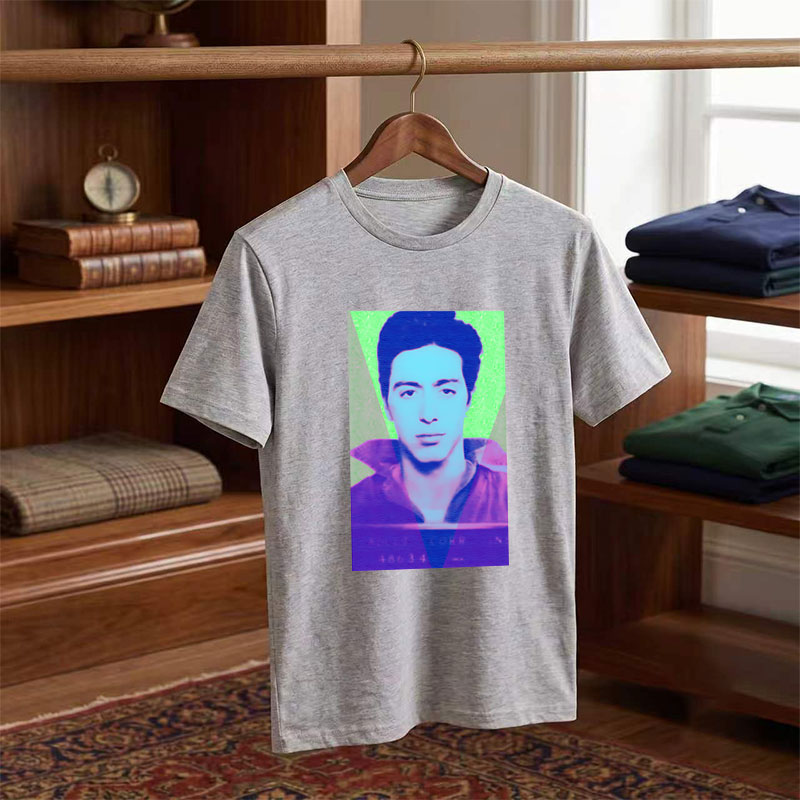 A stylized portrait of a man with vibrant, colorful lighting and geometric overlays. - Tee