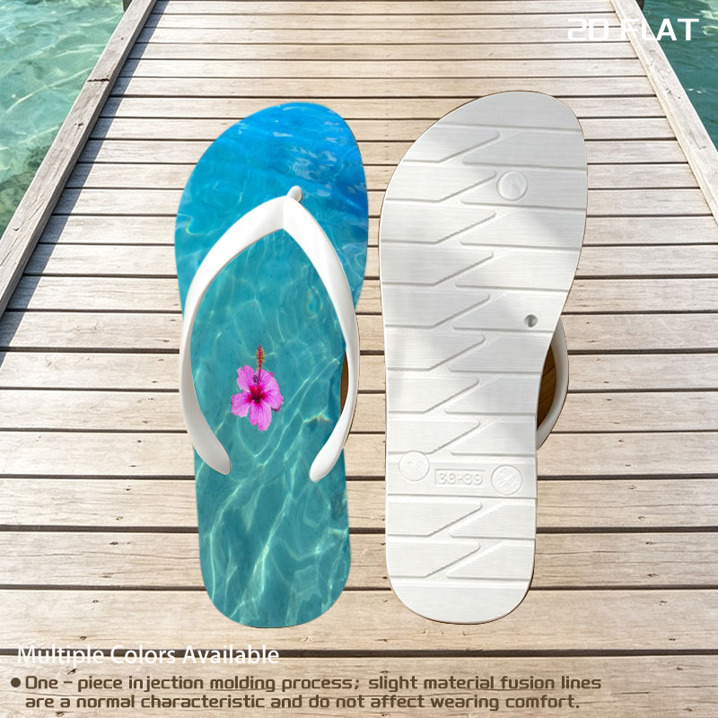 Pink hibiscus floating on crystal clear turquoise water -  flip-flops
