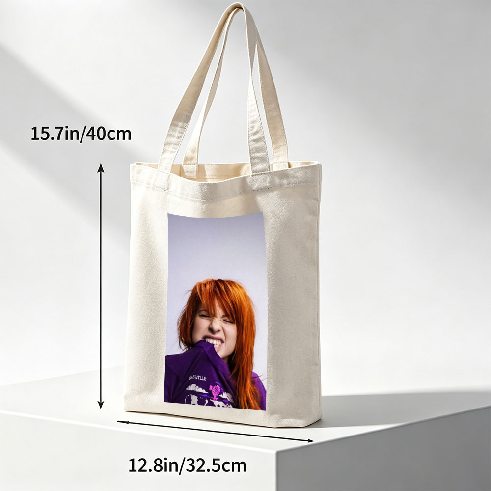 Hayley Williams from Paramore in a Playful Pose Wearing a Purple Nashville Shirt with a Vibrant Design - Canvas tote bags