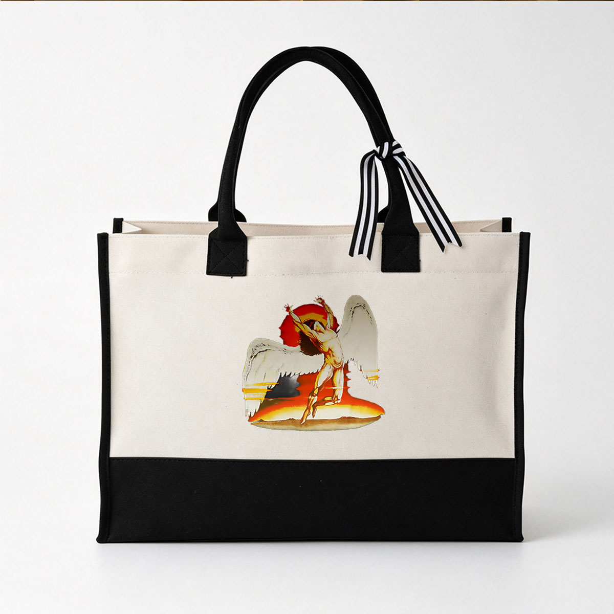 Fallen Angel with Wings Outstretched Against Fiery Background - Canvas patchwork gift tote bag