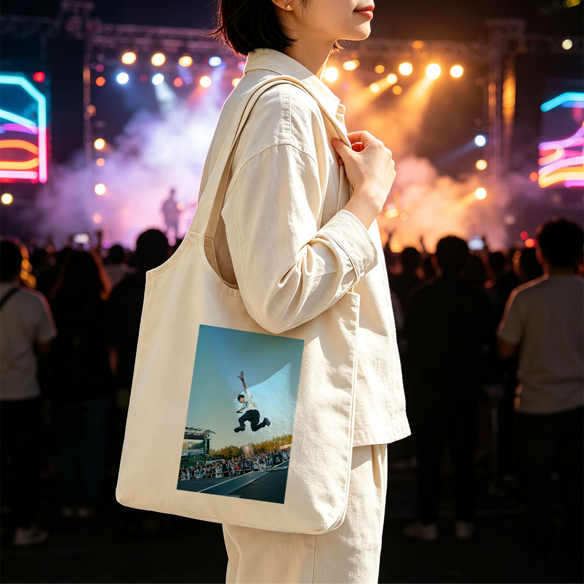 Skateboarder in Mid-Air Trick at Outdoor Festival with Crowd Watching - Canvas shoulder bags/