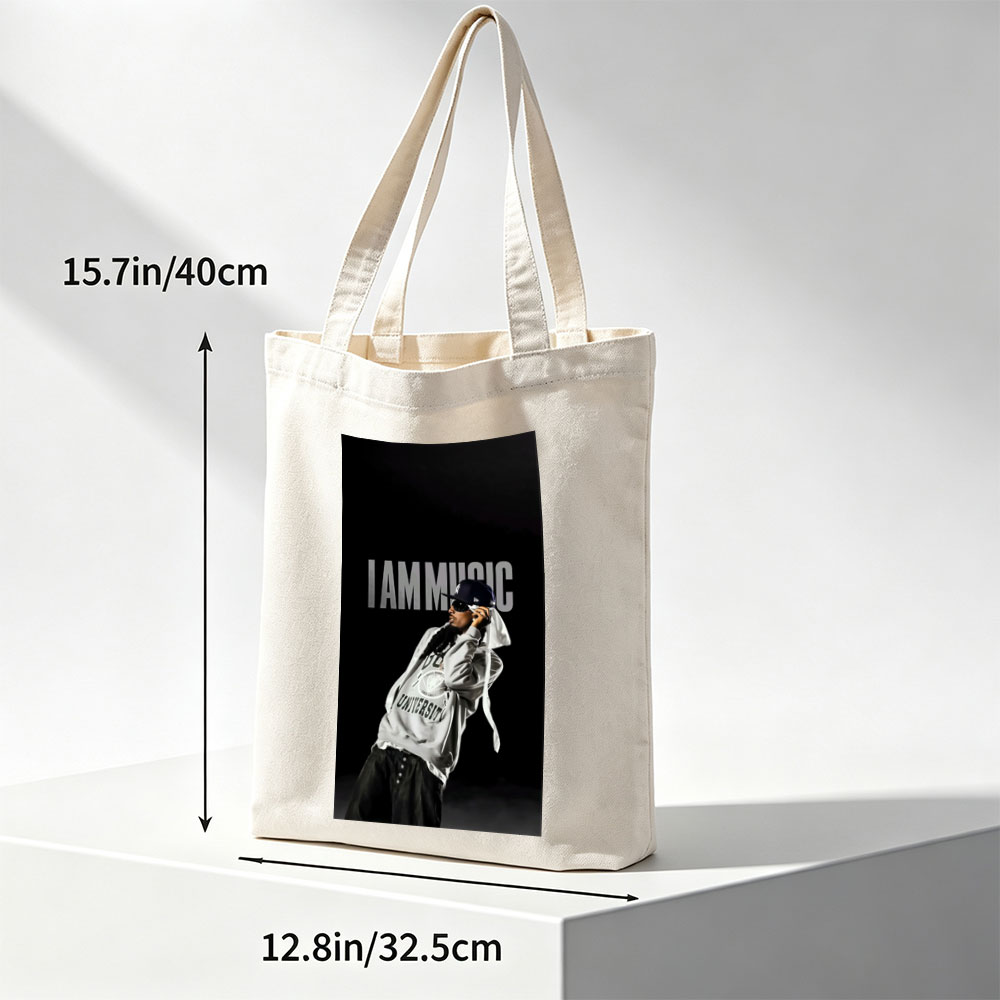 IamMusic Artist in Stylish Pose Wearing Hoodie and Cap Against Dark Background - Canvas tote bags