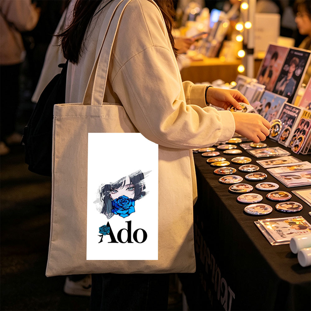 Ado in a Dramatic Portrait with Blue Rose Covering Her Mouth - Canvas tote bags