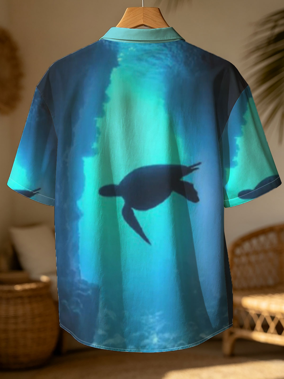 Sea turtle glides through a sunlit underwater cave. -  Shirt