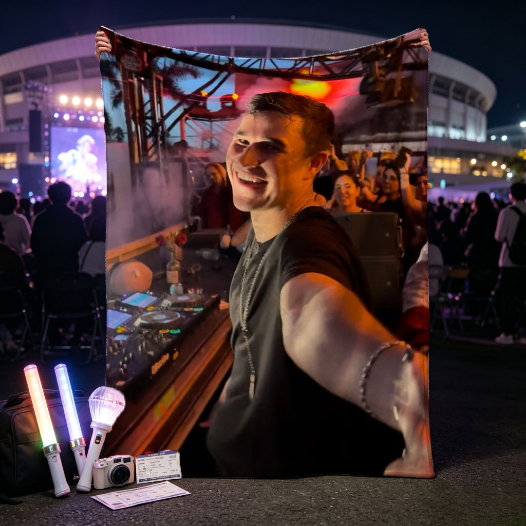 Martin Garrix at a Live DJ Set Performing for an Energetic Crowd Under Colorful Stage Lights - Blankets