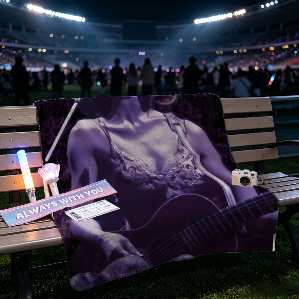 Bj?rk Performing with Guitar in Purple Floral Scene - Blankets