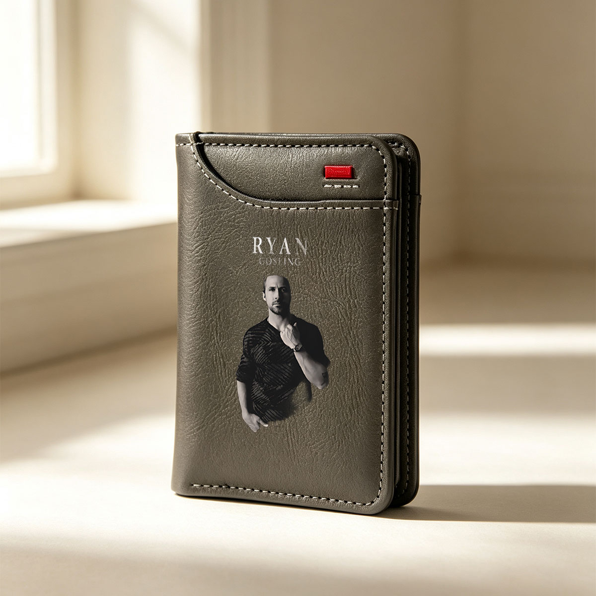 Ryan Gosling in a stylish black shirt, posing with hand on chest against dark background - Vertical Style Wallet