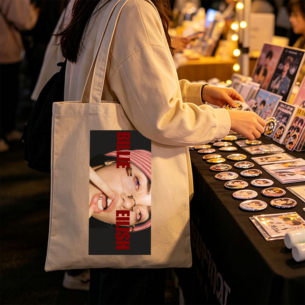 Billie Eilish Close-Up Portrait with Bold Red Text and Striped Beanie - Canvas tote bags