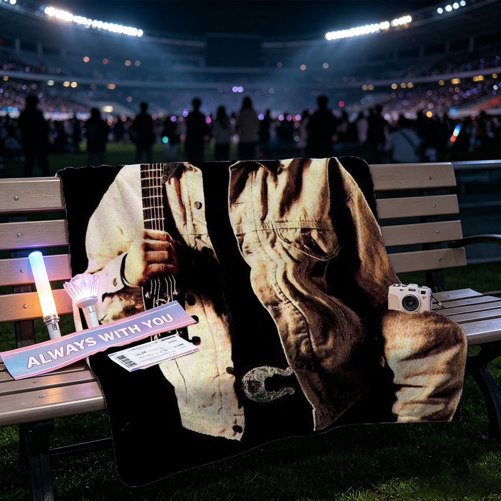 Garth Brook Holding Acoustic Guitar in Cowboy Attire Against Dark Background - Blankets