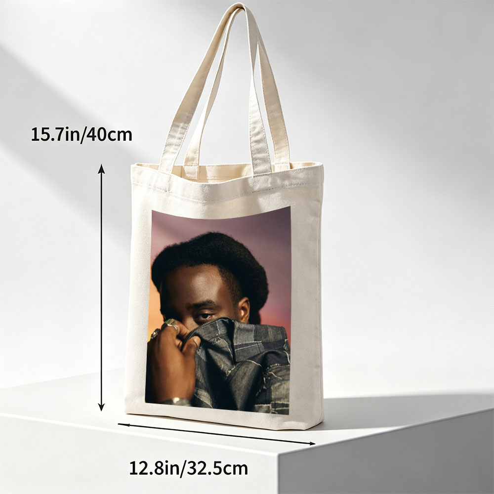 Kendrick Lamar in a Bold Pose Holding Denim Jacket to Face - Canvas tote bags