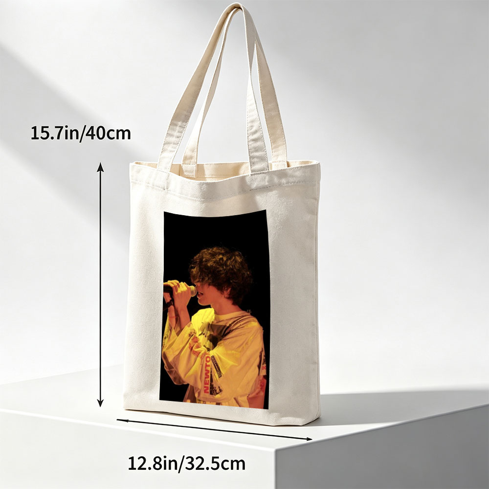 Harry Styles Singing on Stage in a Yellow Outfit with Microphone - Canvas tote bags