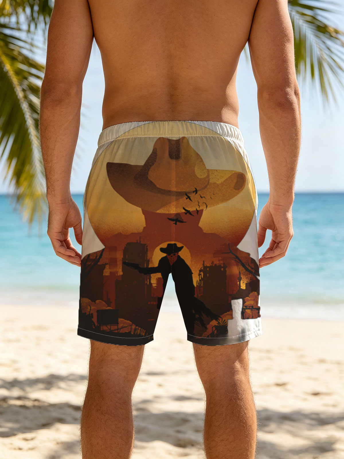 Cowboy Silhouette Against Sunset with Giant Hat and Birds in Sky -  Beach shorts