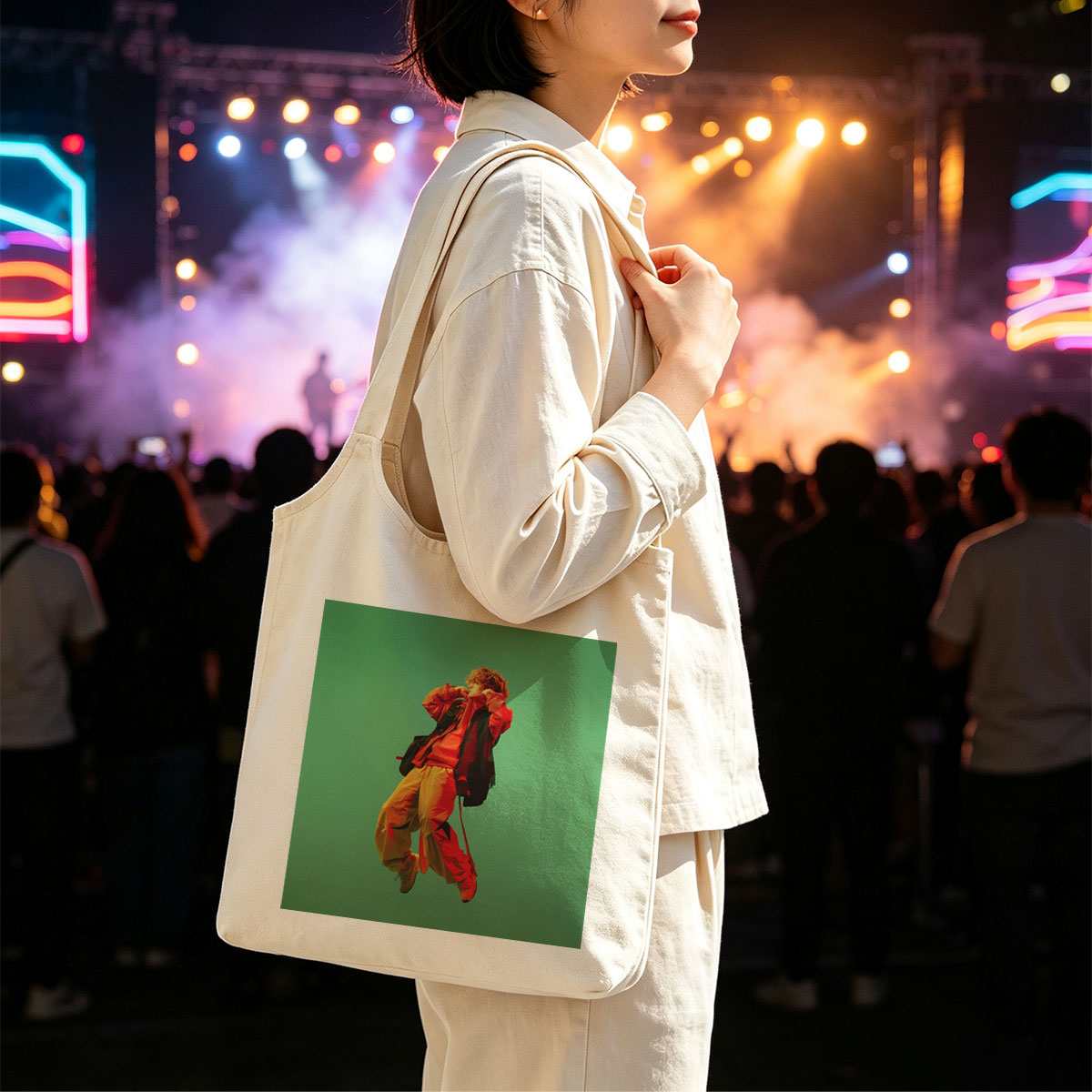 Troye Sivan in a vibrant red and yellow outfit mid-jump against a green background - Canvas shoulder bags/