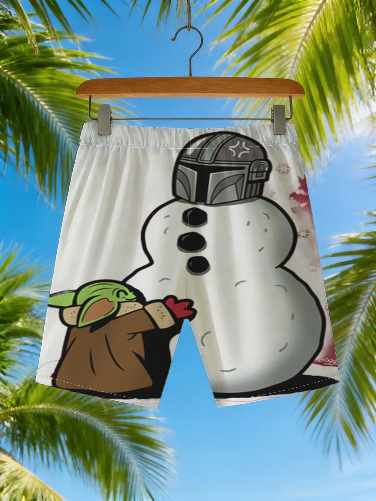 Baby Yoda Builds a Snowman with Mandalorian Helmet -  Beach shorts
