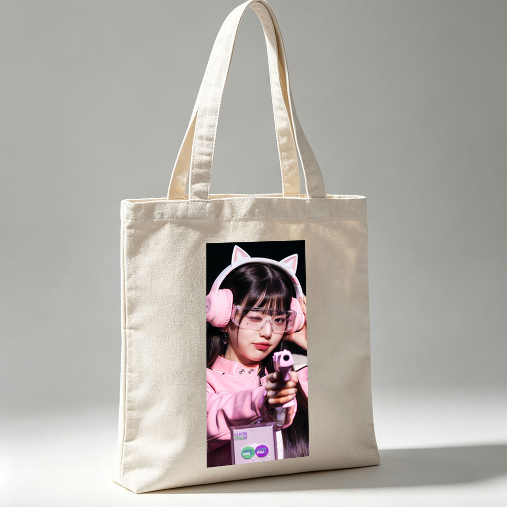 Miu Miu in Pink Cat Ear Headphones Holding a Toy Gun with Clear Glasses and Playful Expression - Canvas tote bags