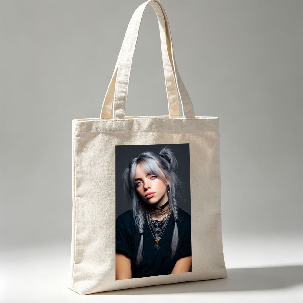 Billie Eilish in a striking portrait with silver hair styled in braids, wearing layered necklaces and a black top against a dark background. - Canvas tote bags