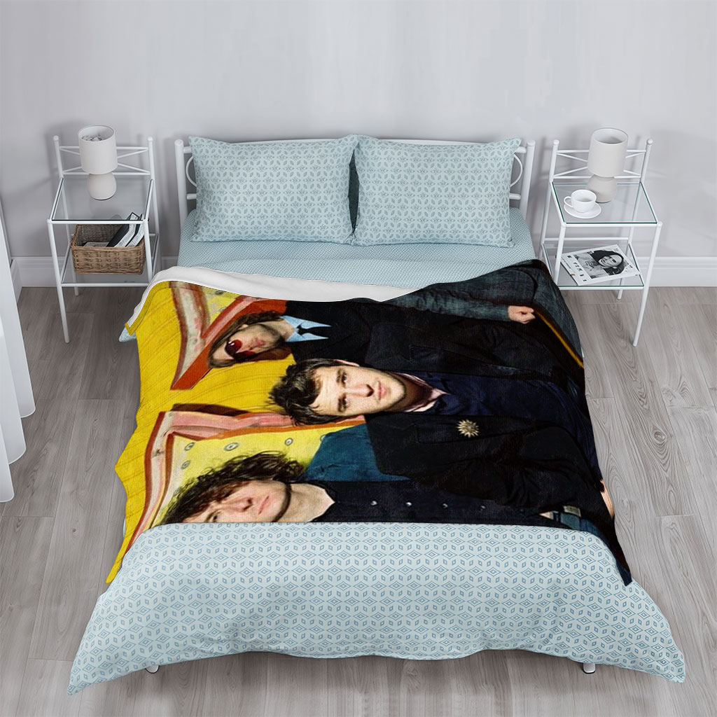 The Killers Band Members in Formal Wear Against a Vibrant Yellow Background - Blankets