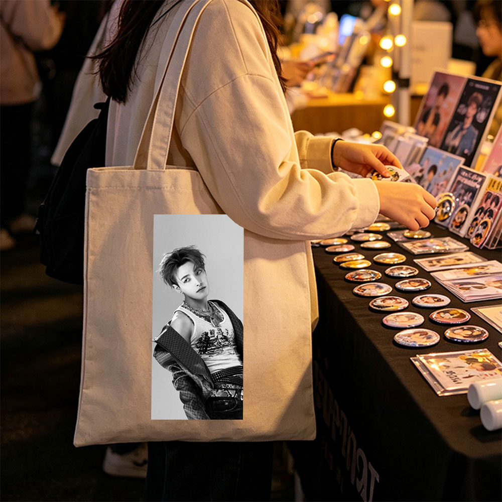 Dino from SEVENTEEN in a stylish black and white portrait wearing a graphic tank top and layered accessories. - Canvas tote bags