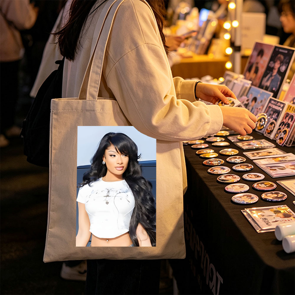 Nicki Minaj in a Stylish White Crop Top with Long Black Hair and Bold Makeup - Canvas tote bags