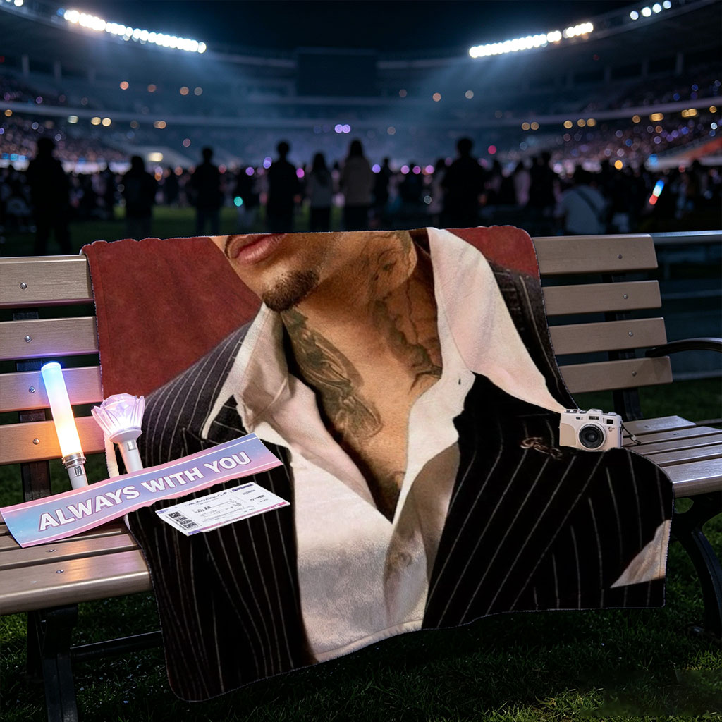 Maluma in a Pinstripe Suit with Visible Neck Tattoos Against a Red Background - Blankets