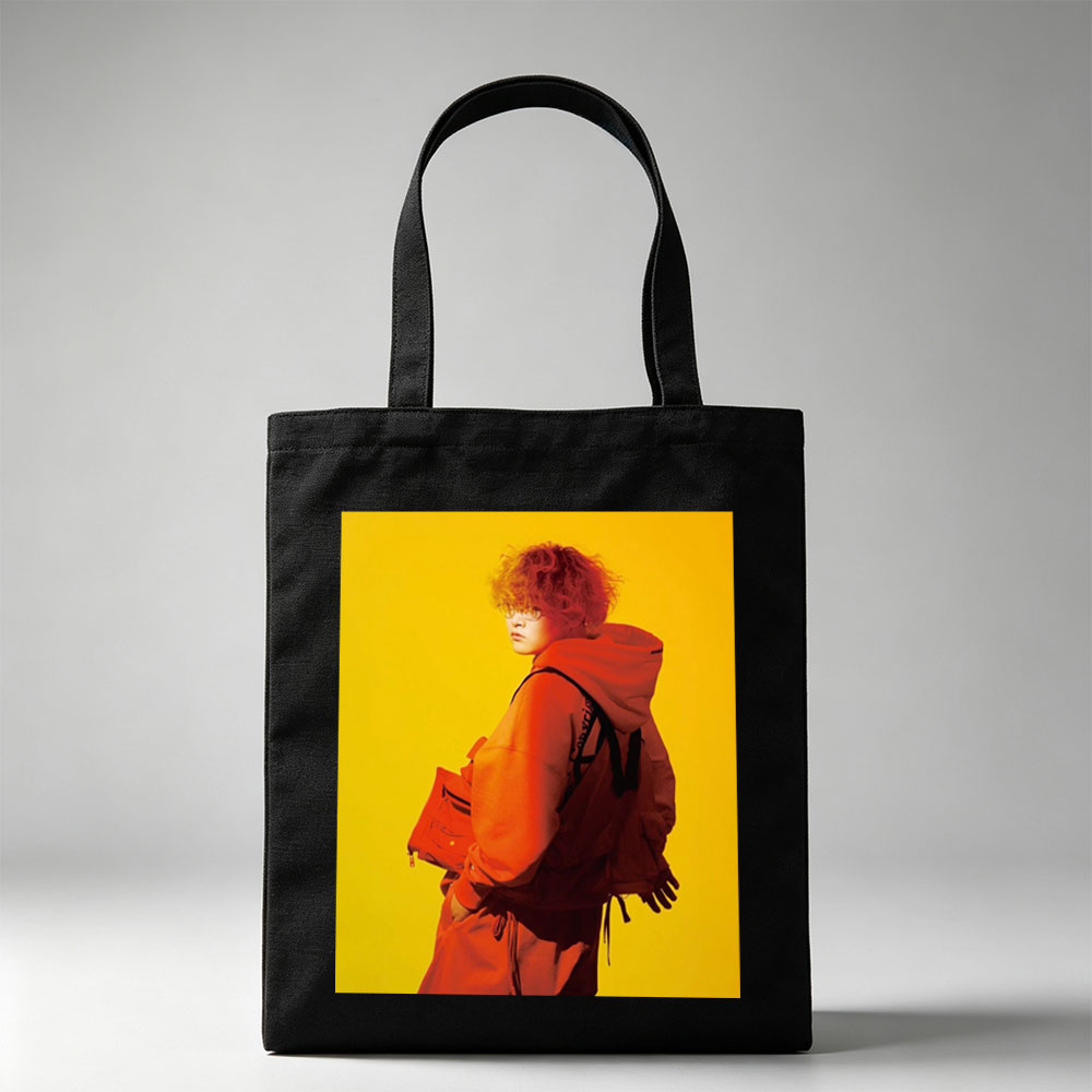 Yuta from Exile Tribe in a Bold Orange Outfit with a Backpack Against a Vibrant Yellow Background - Canvas tote bags