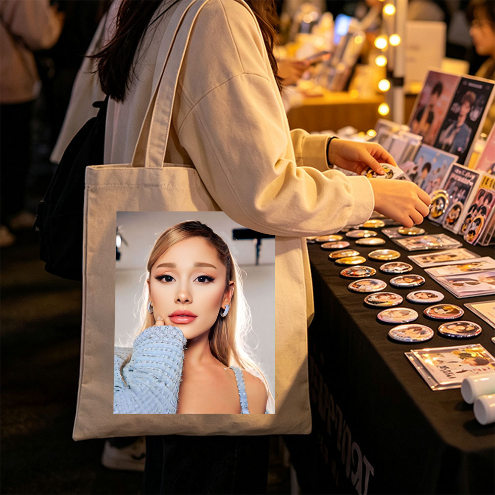 Ariana Grande in a Serene Moment Wearing a Light Blue Textured Top and Elegant Earrings - Canvas tote bags
